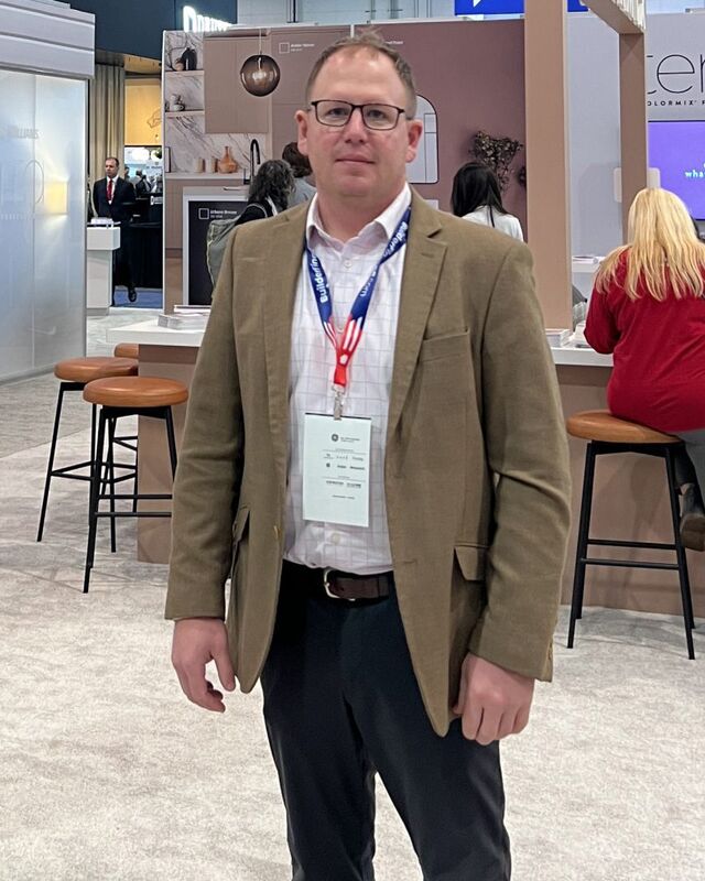 Chris Morris, founder of The Stonegate Group, at a building products trade show