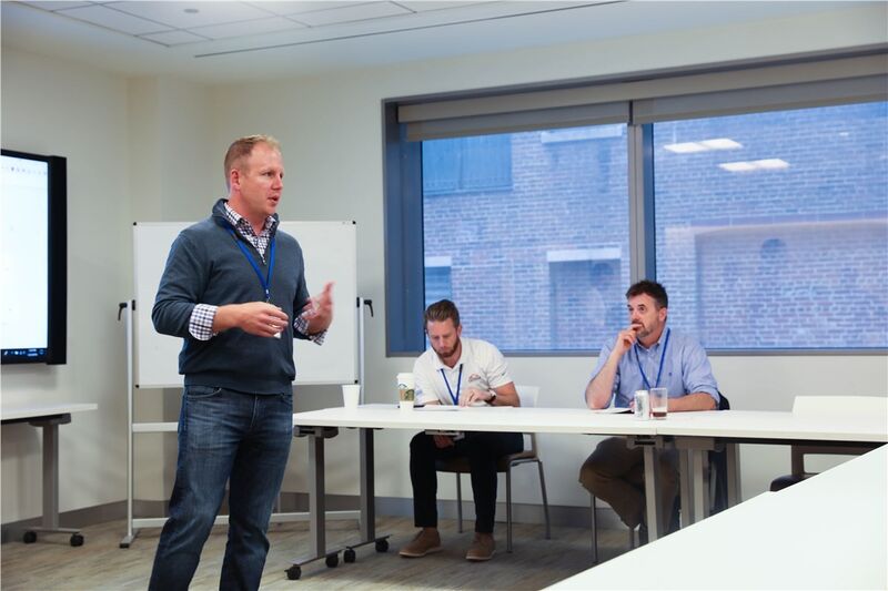 Chris Morris leading a working session with two industry partners